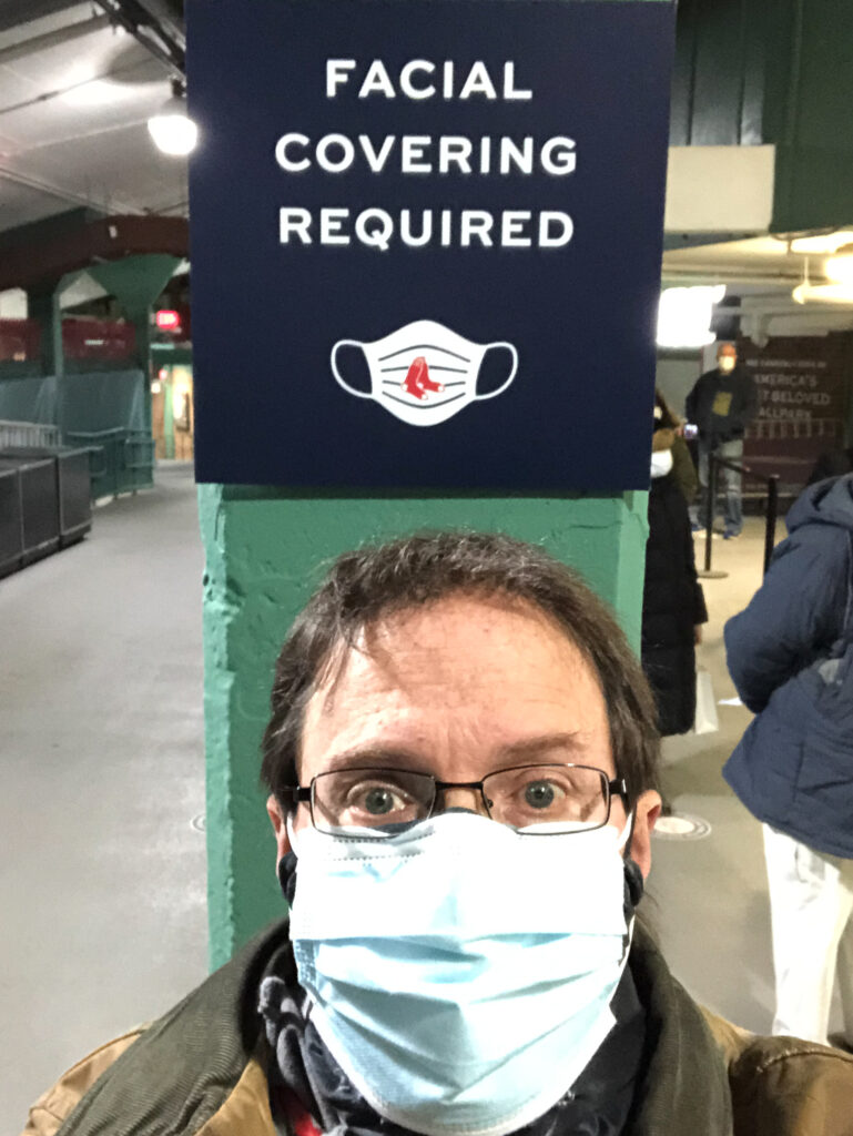 Author in a mask at a vaccine location in MA, USA.